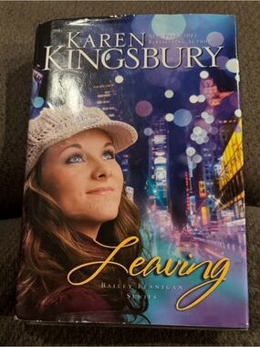"Leaving" Paperback Novel - White Knit Hat Cover